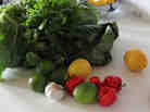 The greens are accompanied by a simple hot sauce of lemon and lime juice with chopped cilantro, garlic and chilies.