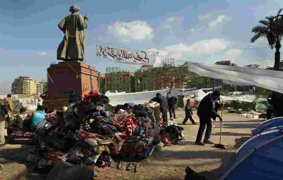 A mountain of blankets sits in an encampment in Tahrir Square. 