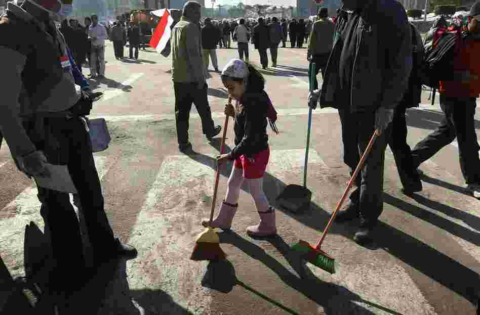 Volunteers clean up Tahrir Square. 