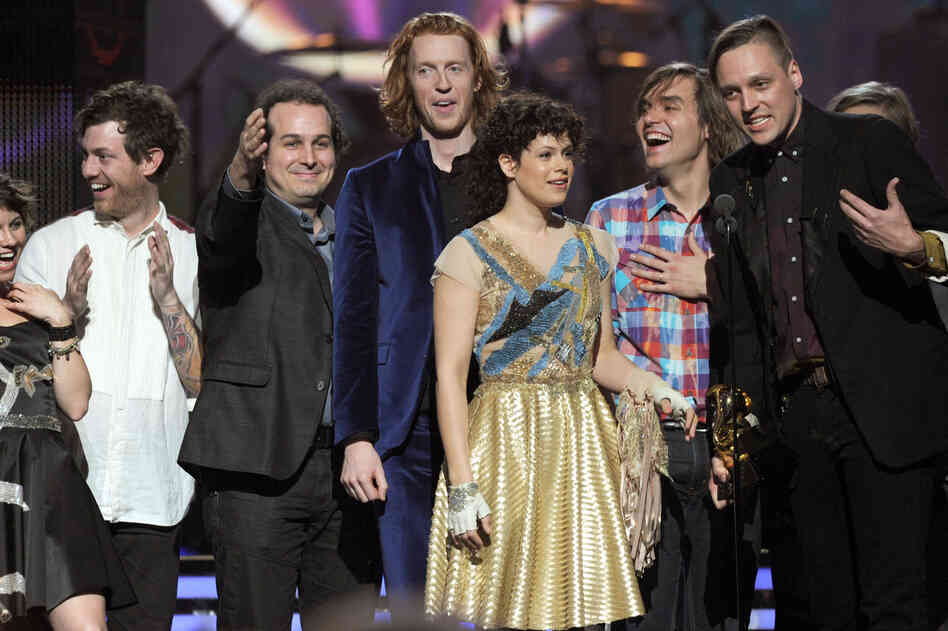 Arcade Fire accepts the Album of the Year Award for The Suburbs onstage during The 53rd Annual Grammy Awards.