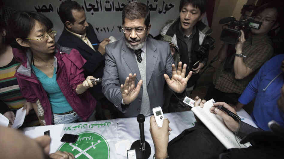 Muslim Brotherhood spokesman Mohammed Mursi takes questions from local and international journalists at the end of a news conference Feb. 9 in Cairo. Muslim Brotherhood spokesman Mohammed Mursi takes questions from local and international journalists at the end of a news conference Feb. 9 in Cairo.
