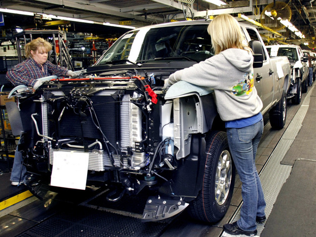 Workers on a Chevrolet pickup truck assembly line in Flint, Mich., on Jan. 24, 2011.