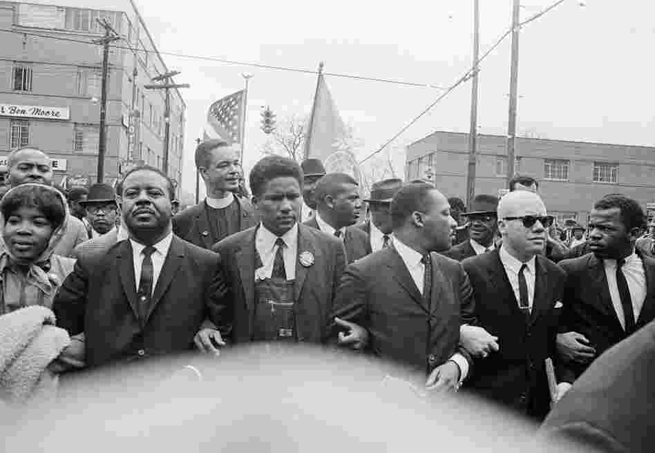 John Lewis (right) joins a march to the Montgomery, Ala., courthouse with the Rev. Martin Luther King Jr. (third from right) and his aides, March 17, 1965.