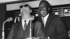 British jazz pianist George Shearing (left) and American singer Joe Williams attend a press reception in London in 1962 before beginning a tour of Britain together. British jazz pianist George Shearing (left) and American singer Joe Williams attend a press reception in London in 1962 before beginning a tour of Britain together.