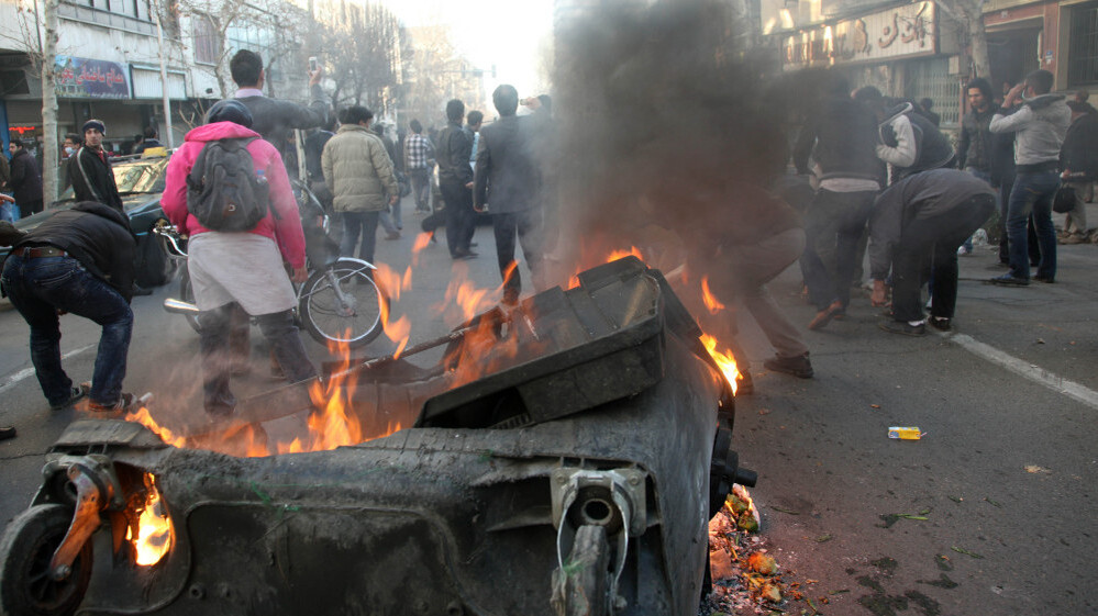 This photo, taken by an individual not employed by the Associated Press and obtained by the AP outside Iran, shows Iranian protestors attending  an anti-government protest as a trash dumpster is set on fire, in Tehran, earlier today (Feb. 14, 2011).
