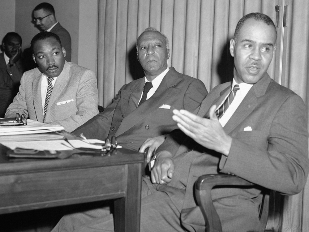 Three civil rights leaders hold a news conference, April 5, 1957, to announce plans for a prayer pilgrimage to Washington on May 17, the third anniversary of the Supreme Court's decision against segregated schools. From left are the Rev. Martin Luther King Jr., A. Philip Randolph and Roy Wilkins.