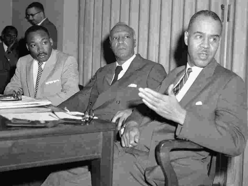 Three civil rights leaders hold a news conference, April 5, 1957, to announce plans for a prayer pilgrimage to Washington on May 17, the third anniversary of the Supreme Court's decision against segregated schools. From left are the Rev. Martin Luther King Jr., A. Philip Randolph and Roy Wilkins.