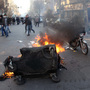 A garbage container burned during protests Monday (Feb. 14, 2011) in Tehran.