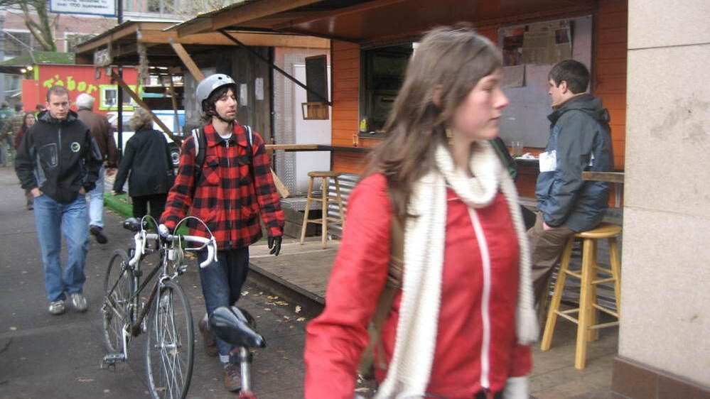 Economists say unemployment is high in Portland and wages are low. But the city is still attracting young, white professionals from the Northeast and Midwest.