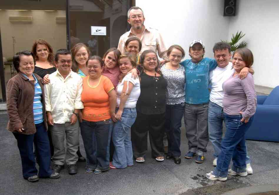 Jaime Guevara-Aguirre stands with  some of the people who took part in his study of Laron syndrome in Ecuador.