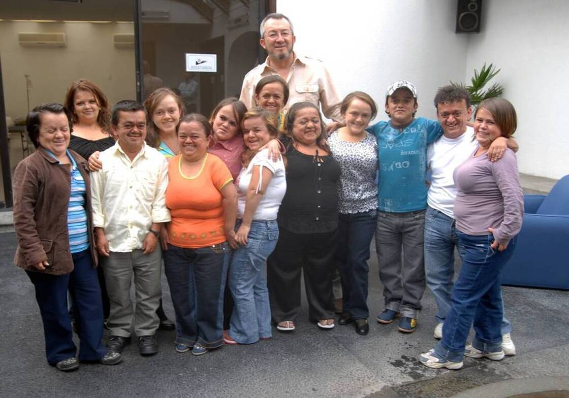 Jaime Guevara-Aguirre stands with  some of the people who took part in his study of Laron syndrome in Ecuador.