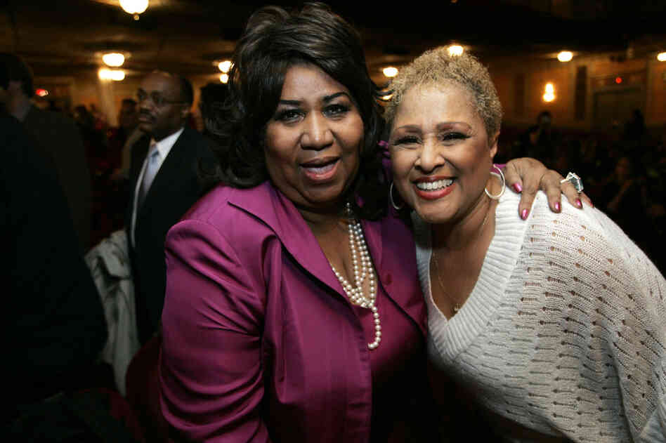 Aretha Franklin (left) poses with Love, at the time a cast member of the Broadway show "Hairspray," in 2007. Once established, Love took Phil Spector to court for a share of the royalties owed to her from the '60s — and won. 