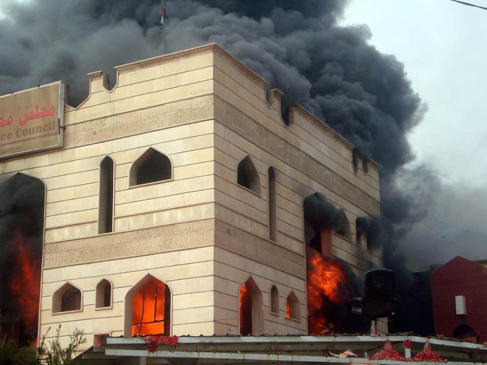 Flames engulfed an Iraqi government building in the southern city of Kut after it was set on fire by protesters demanding the provincial governor's resignation.