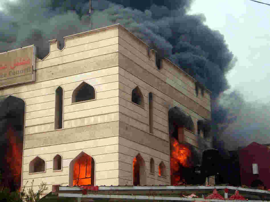Flames engulfed an Iraqi government building in the southern city of Kut after it was set on fire by protesters demanding the provincial governor's resignation.