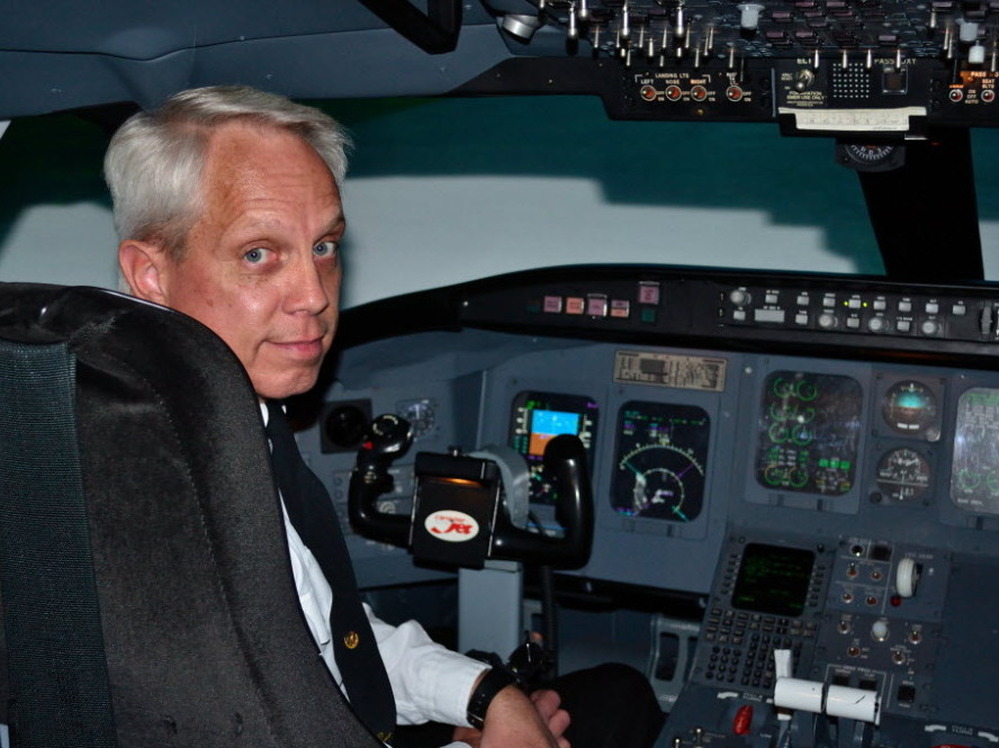 Flight instructor Tom Peterson uses a simulated Canadair Regional Jet  flight deck at Embry-Riddle Aeronautical University to teach pilots how to fly a modern aircraft, which relies heavily on computer automation.