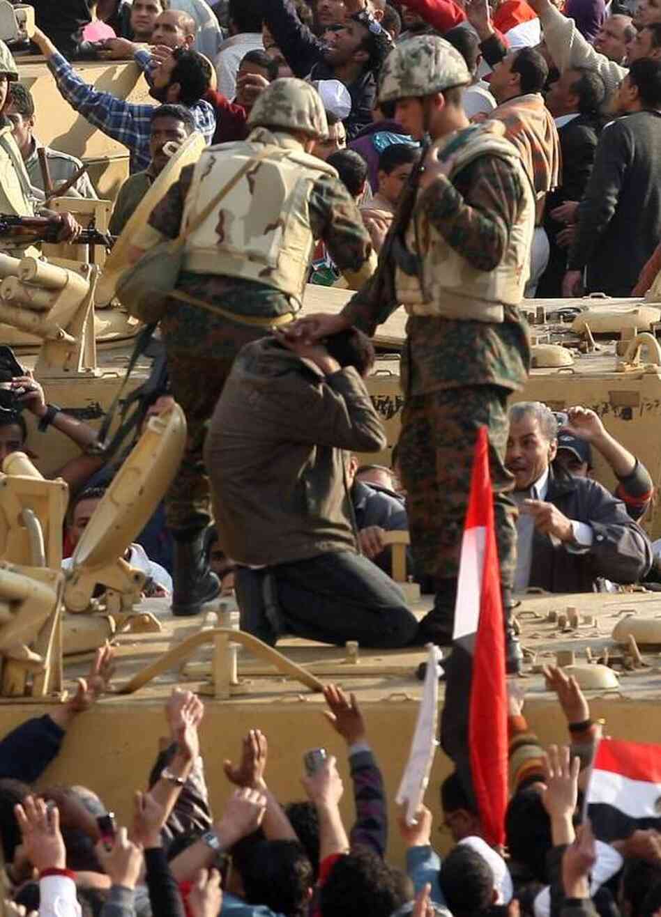 Egyptian soldiers detained this anti-government demonstrator in Cairo's Tahrir square on Feb. 2, 2011.