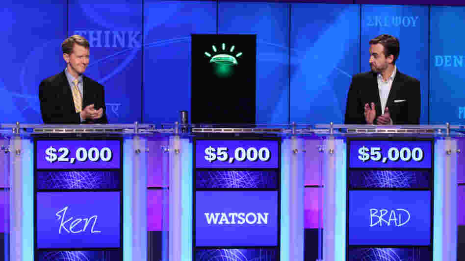 Ken Jennings, left, and Brad Rutter, right, applauded for Watson earlier in the competition.