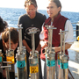 Researchers aboard the Atlantis, a research vessel operated by the Woods Hole Oceanographic Institution, examine core samples brought up from the sea floor of the Gulf of Mexico by the deep-sea submersible Alvin on Nov. 24, 2010. The scientific community is conflicted about the lack of direction, coordination and funding in studying the aftermath of the Gulf of Mexico oil spill. Researchers aboard the Atlantis, a research vessel operated by the Woods Hole Oceanographic Institution, examine core samples brought up from the sea floor of the Gulf of Mexico by the deep-sea submersible Alvin on Nov. 24, 2010. The scientific community is conflicted about the lack of direction, coordination and funding in studying the aftermath of the Gulf of Mexico oil spill.