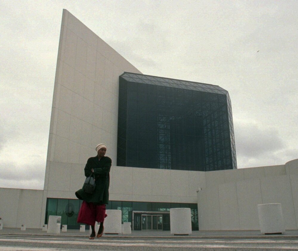 A worker at the John F. Kennedy Library and Museum in Boston leaves after being ordered out due to a 1995 government shutdown.
