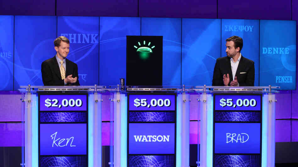 Jeopardy contestants Ken Jennings (left), Brad Rutter and a computer named Watson.