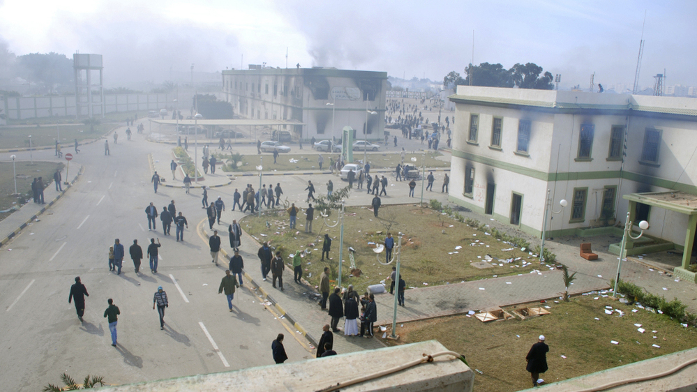 Buildings at the entrance to a Libyan security compound in Benghazi were burning on Monday.
