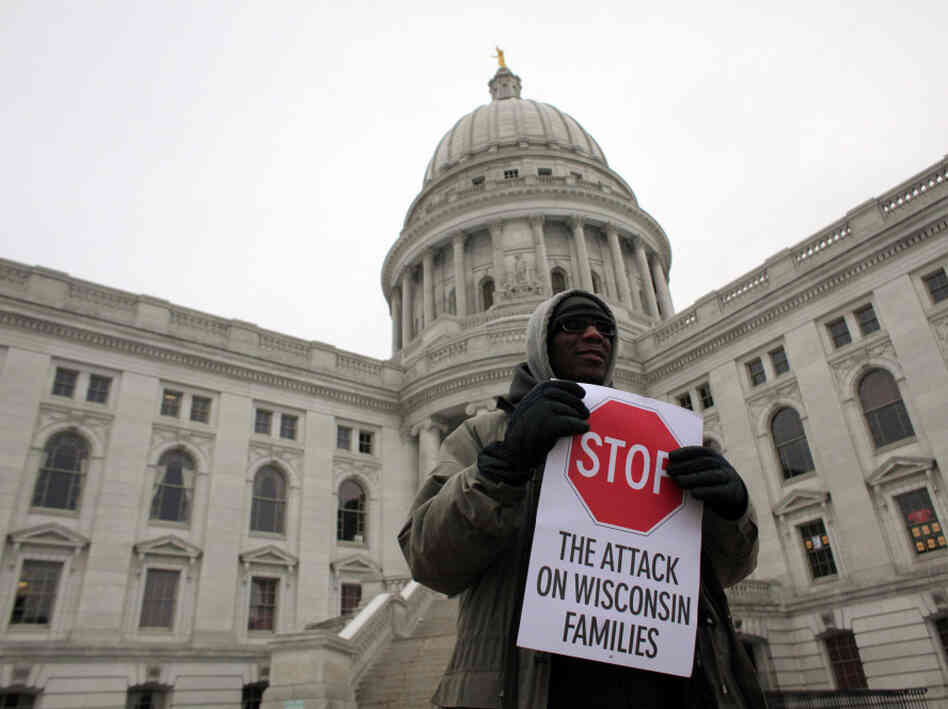 A protester rallied outside the Wisconsin State Capitol in Madison on Monday.