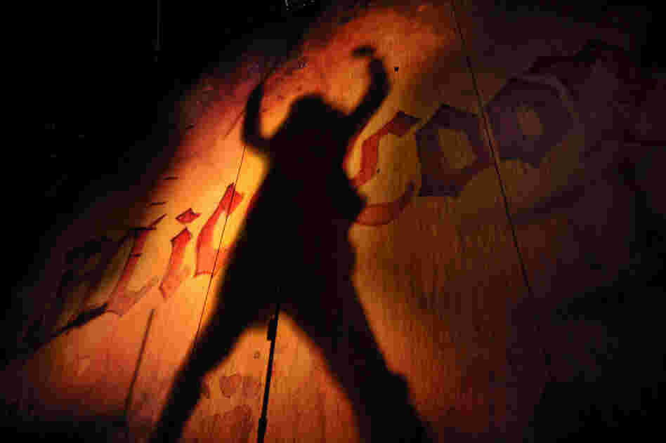Cooper is silhouetted against the backdrop of the Auditorium Stravinski stage during his performance at the Montreux Jazz Festival in 2009. 
