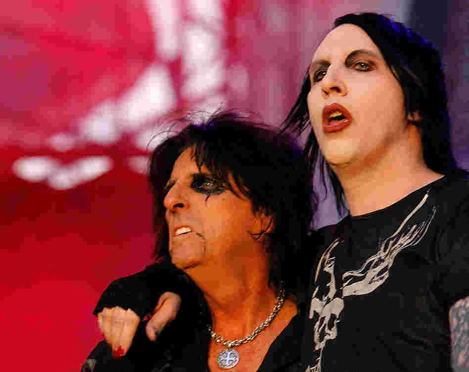 Marilyn Manson (right) performs with Cooper during a concert in Bucharest, Romania. Cooper's gory and scandalous stage act became fodder for later shock rockers like Manson and Rob Zombie. 