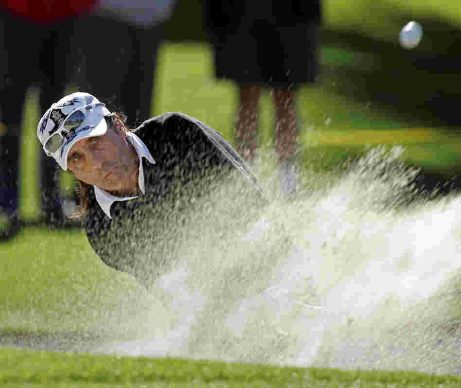 An avid golfer, Cooper regularly plays in tournaments and has cited the sport as having a big influence on his life, helping him overcome his alcoholism. Here, he blasts out of a bunker on the 10th hole during the second round of the Bob Hope Chrysler Classic golf tournament in 2008. 