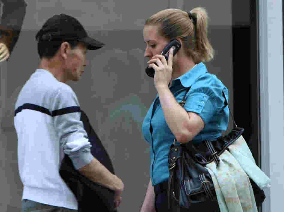 A new study finds that radio waves from a cell phone can affect the metabolism of brain cells, though there is no evidence that the effect is harmful. Here, a pedestrian talks on her phone on a street in San Francisco.