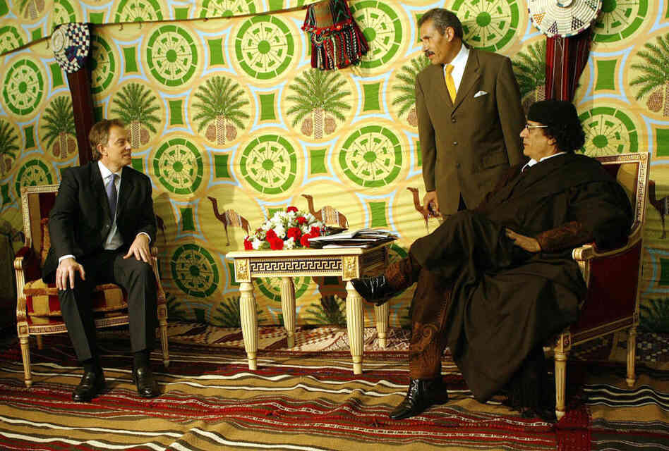 Then-British Prime Minister Tony Blair sitting with Libyan leader Moammar Gadhafi in 2004 in Tripoli. Then-British Prime Minister Tony Blair sitting with Libyan leader Moammar Gadhafi in 2004 in Tripoli.