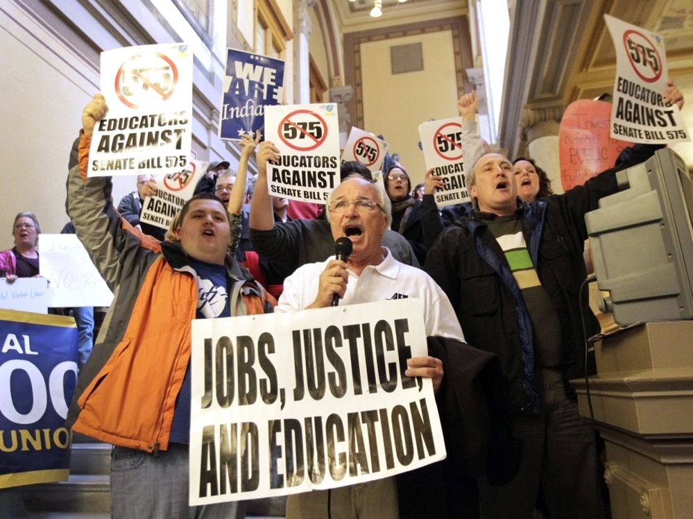 Rick Muir, president of the Indiana Federation  of Teachers, chants with other protesters at the statehouse in  Indianapolis on Feb. 23. Teacher groups are protesting Indiana Senate bill 575 which would remove some collective bargaining rights for teachers.