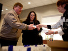 Roni Chambers, executive director of Go! Network (right), checks in Jennifer Barfield, 47, and her husband, Brian Barfield, 53, at a job networking meeting in downtown St. Louis. Roni Chambers, executive director of Go! Network (right), checks in Jennifer Barfield, 47, and her husband, Brian Barfield, 53, at a job networking meeting in downtown St. Louis.