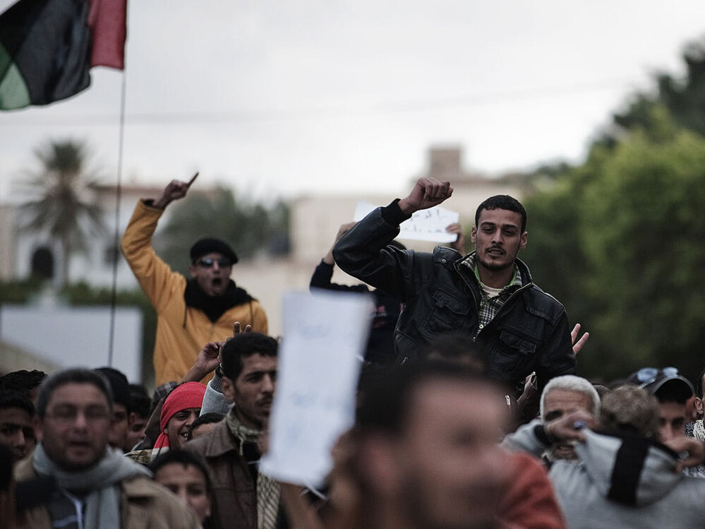 Libyan  protesters shout anti-Gadhafi slogans during a demonstration in the eastern  Libyan town of Derna on Wednesday.
