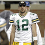 Green Bay quarterback Aaron Rodgers walks off the field at halftime after leaving a game against Detroit with a concussion, Dec. 12, 2010.