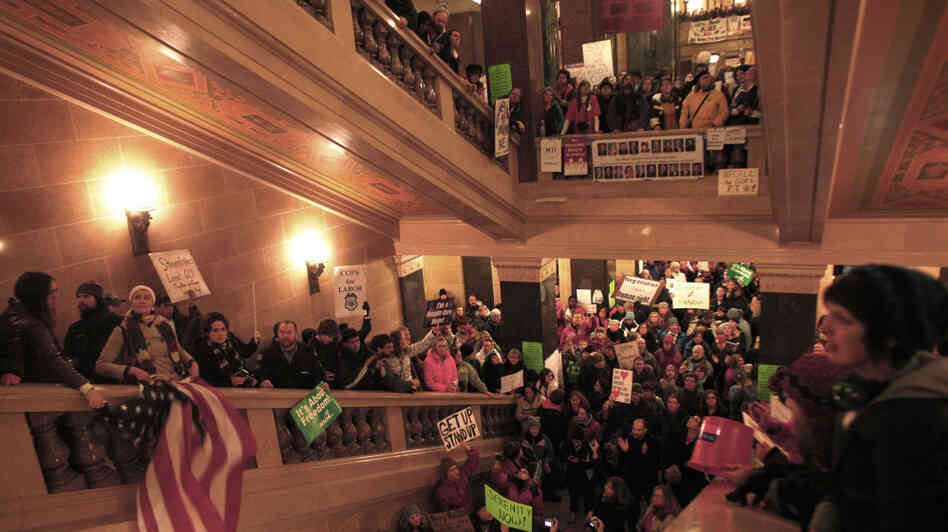 Protesters demonstrate outside the office of Wisconsin Gov. Scott Walker during his fireside chat Tuesday at the Capitol.