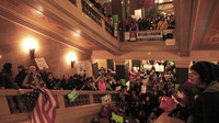 Protesters demonstrate outside the office of Wisconsin Gov. Scott Walker during his fireside chat Tuesday at the Capitol.
