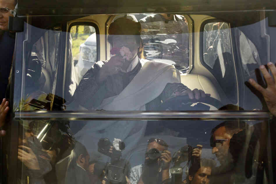 Gadhafi drives away in an electric golf cart after speaking in Tripoli on Wednesday after addressing supporters and the media. 