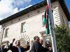 In Washington, D.C., Libyan embassy staff raise the pre-Moammar Gadhafi flag at the just-resigned ambassador's residence. In Washington, D.C., Libyan embassy staff raise the pre-Moammar Gadhafi flag at the just-resigned ambassador's residence.