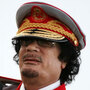 Libyan  leader Moammar Gadhafi speaks in Tripoli on June 12, 2010, during a ceremony marking the 40th anniversary of  the evacuation of the American military bases in the country.