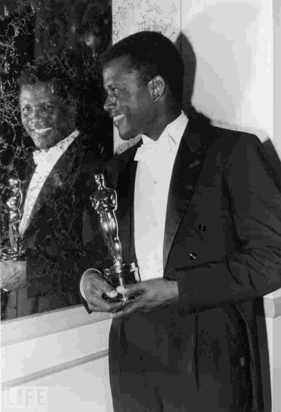 Sidney Poitier beams backstage after becoming the first black performer to win a lead acting Oscar, for his handyman role in Lilies of the Field in 1964. Sidney Poitier beams backstage after becoming the first black performer to win a lead acting Oscar, for his handyman role in Lilies of the Field in 1964.