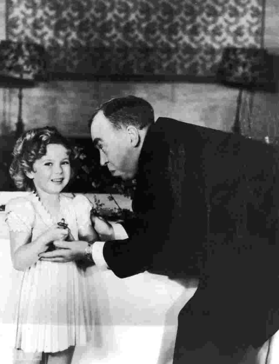 Screenwriter Irvin S. Cobb, host of the 1935 Academy Awards, gives a special, tiny Oscar to Shirley Temple for her "outstanding contribution" to the industry in 1934, a year when the 6-year-old star made 12 movies. Screenwriter Irvin S. Cobb, host of the 1935 Academy Awards, gives a special, tiny Oscar to Shirley Temple for her "outstanding contribution" to the industry in 1934, a year when the 6-year-old star made 12 movies.
