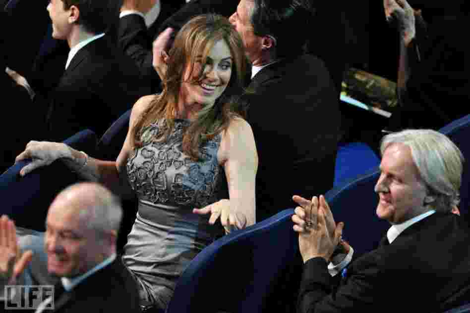 During the 2010 Oscars, The Hurt Locker director Kathryn Bigelow glances back at her ex-husband, Avatar director James Cameron. Their movies had been competing all Oscar season. On the big night, Bigelow's movie came out on top, scoring six wins to Avatar's three. Bigelow became the first-ever female director to win an Oscar. During the 2010 Oscars, The Hurt Locker director Kathryn Bigelow glances back at her ex-husband, Avatar director James Cameron. Their movies had been competing all Oscar season. On the big night, Bigelow's movie came out on top, scoring six wins to Avatar's three. Bigelow became the first-ever female director to win an Oscar.
