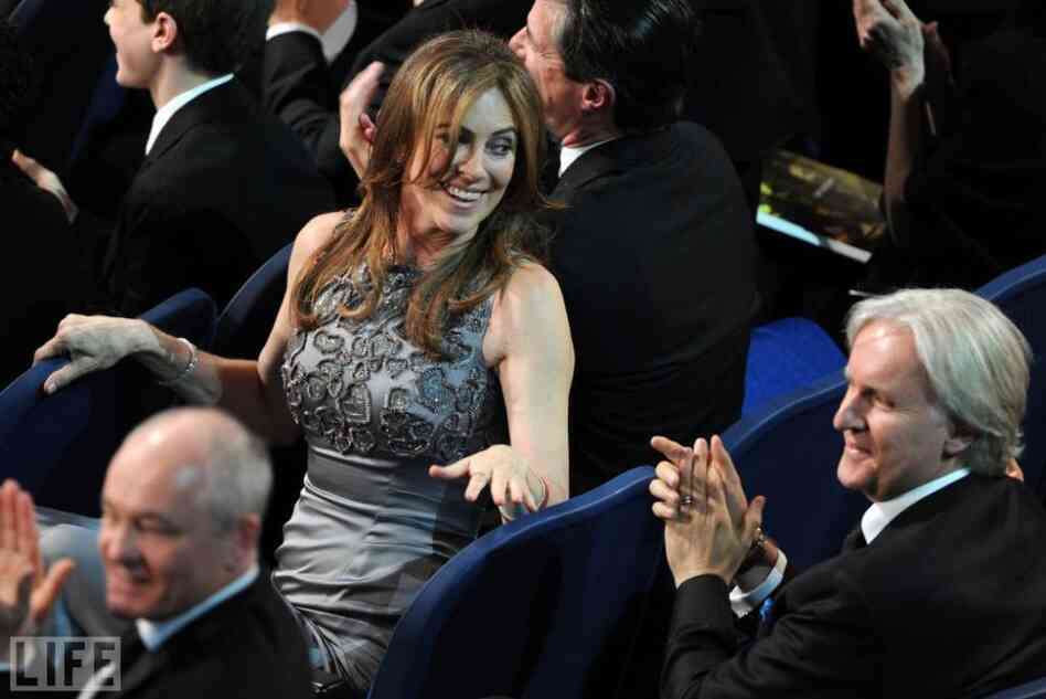 During the 2010 Oscars, The Hurt Locker director Kathryn Bigelow glances back at her ex-husband, Avatar director James Cameron. Their movies had been competing all Oscar season. On the big night, Bigelow's movie came out on top, scoring six wins to Avatar's three. Bigelow became the first-ever female director to win an Oscar. During the 2010 Oscars, The Hurt Locker director Kathryn Bigelow glances back at her ex-husband, Avatar director James Cameron. Their movies had been competing all Oscar season. On the big night, Bigelow's movie came out on top, scoring six wins to Avatar's three. Bigelow became the first-ever female director to win an Oscar.