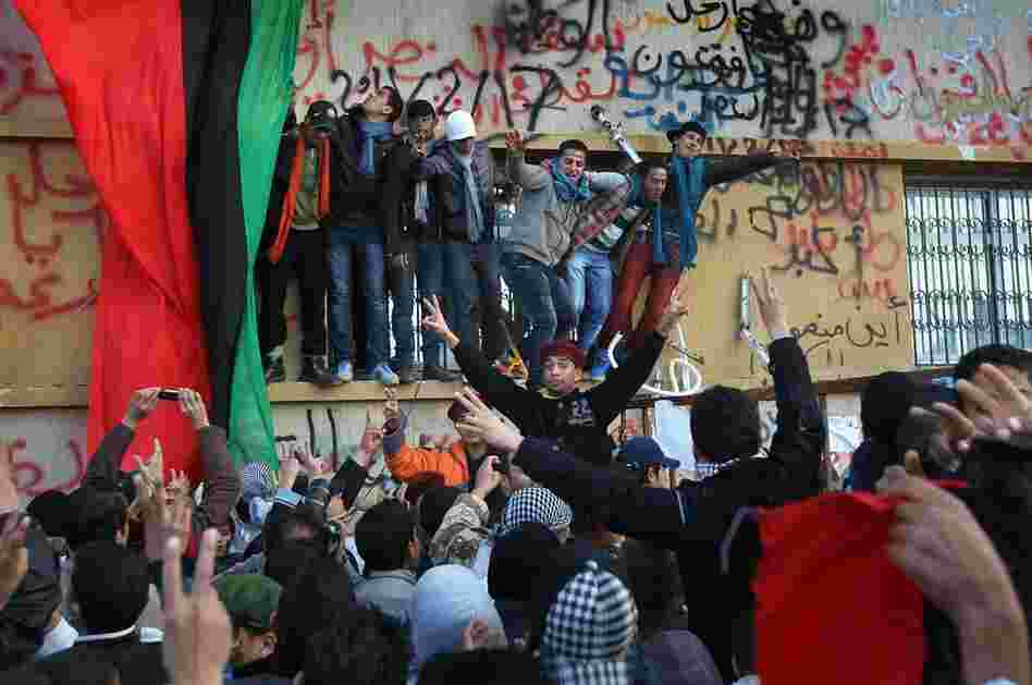 Crowds celebrate in Benghazi on Saturday, still demanding Gadhafi's removal from power. 