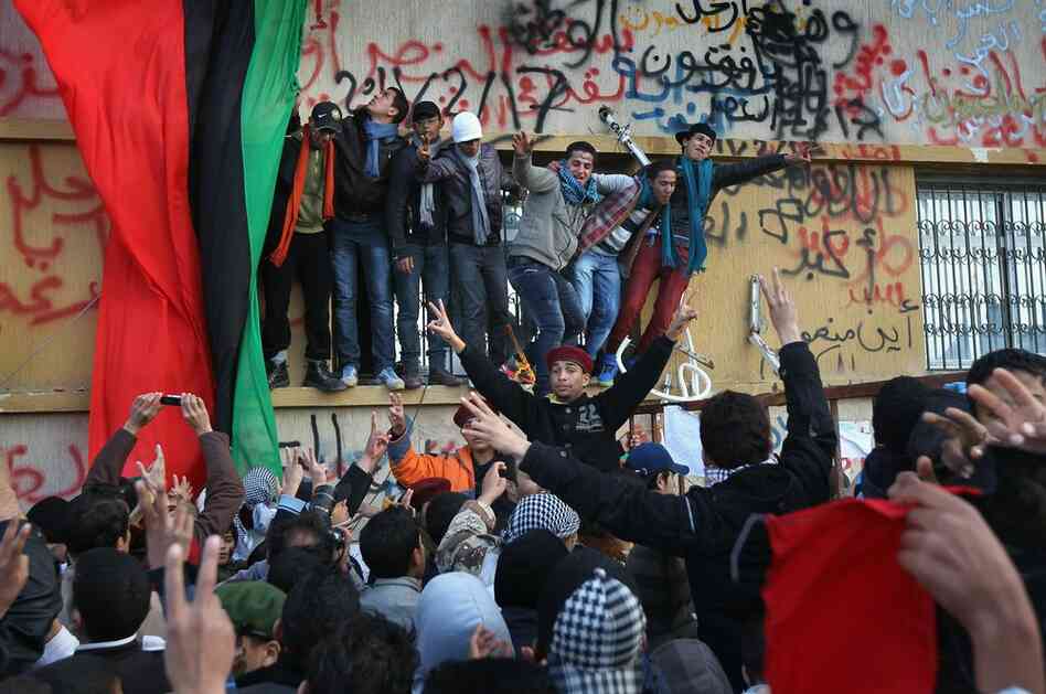 Crowds celebrate in Benghazi on Saturday, still demanding Gadhafi's removal from power. 