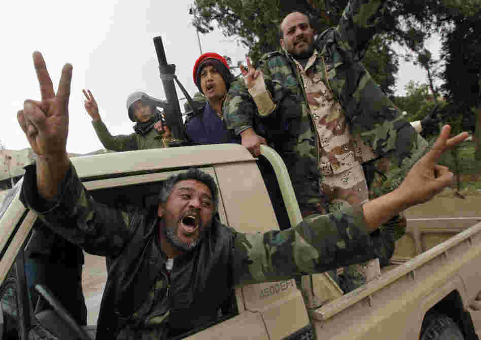 Rebels celebrate Sunday in the streets of Benghazi, no longer under the control of Gadhafi's government. 