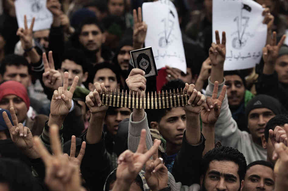 Libyan rebels gather for prayer on March 4. Loyalist forces have launched a fresh air strike on opposition territory in the east, while pumped-up opposition fighters pushed forward the frontline against Moammar Gadhafi's regime. 