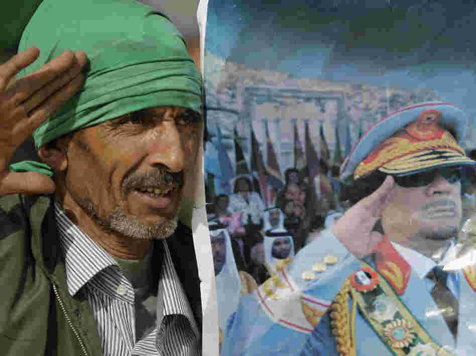 A Gadhafi supporter simulates the salute portrayed in a photograph of Libyan Leader Moammar Gadhafi, as he and others stage a small rally on the stage of the Roman amphitheatre at the Sabratha archaeological site.