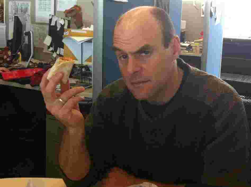 Peter holds the Beefy Crunch Burrito.